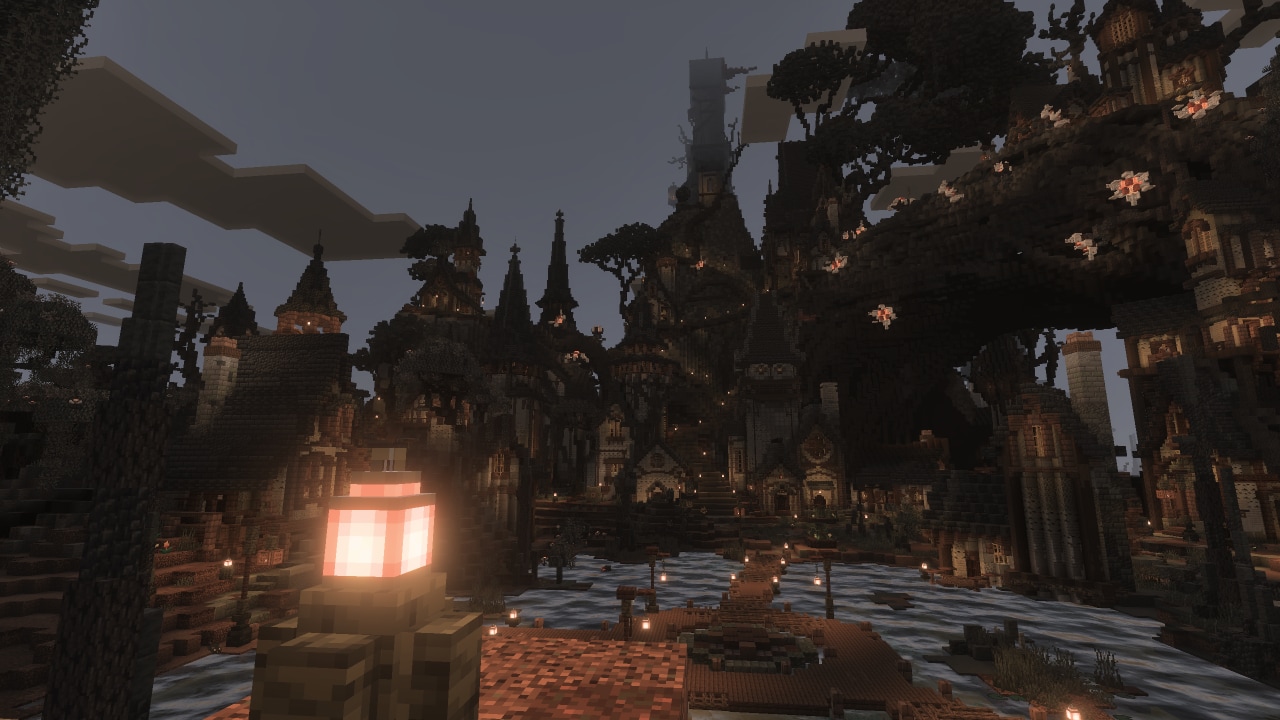 A sprawling dark Minecraft settlement features towering Gothic-style buildings, bridges, glowing lights, and massive trees.